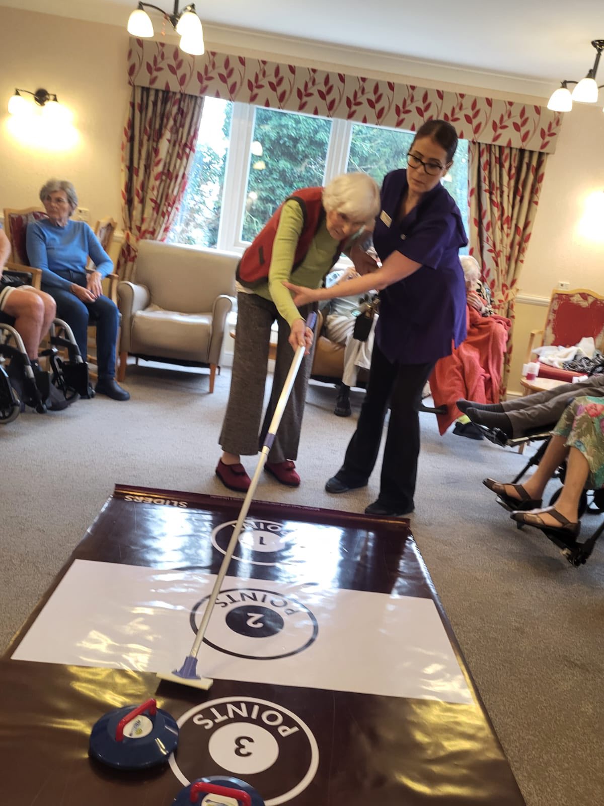 Park View Care Home Resident playing curling